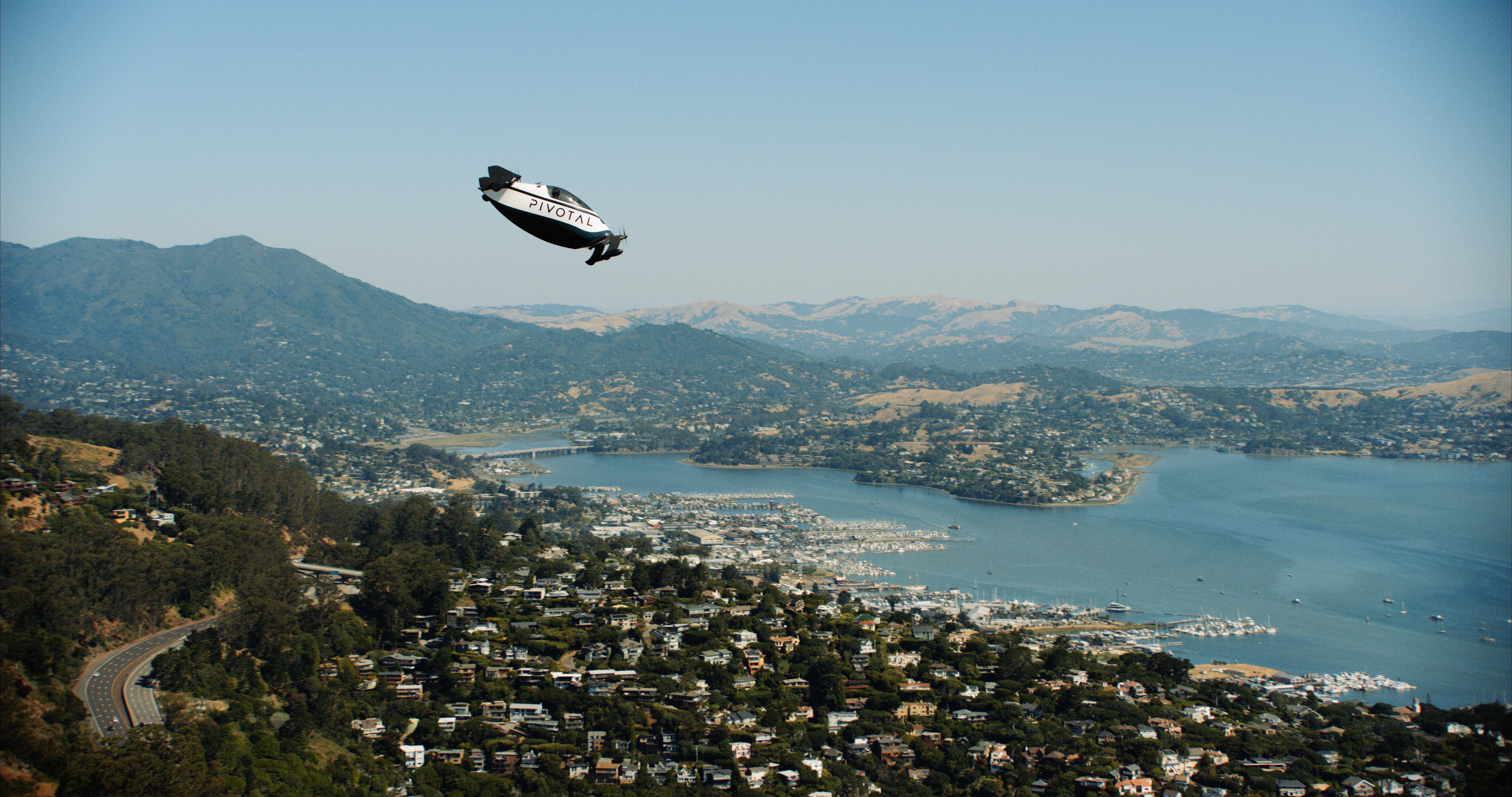 Pivotal aircraft flying over Sausalito beach
